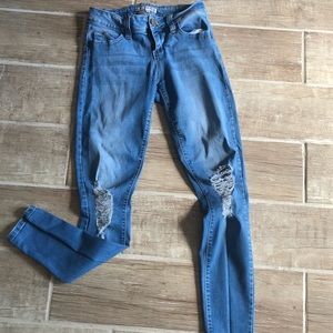 Blue distressed skinny jeans